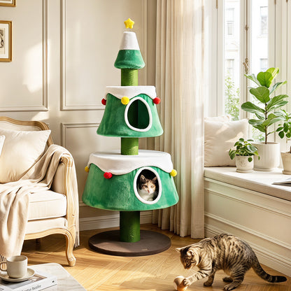 A green cat Christmas tree with two condos and scratching posts in a living room with a cat playing