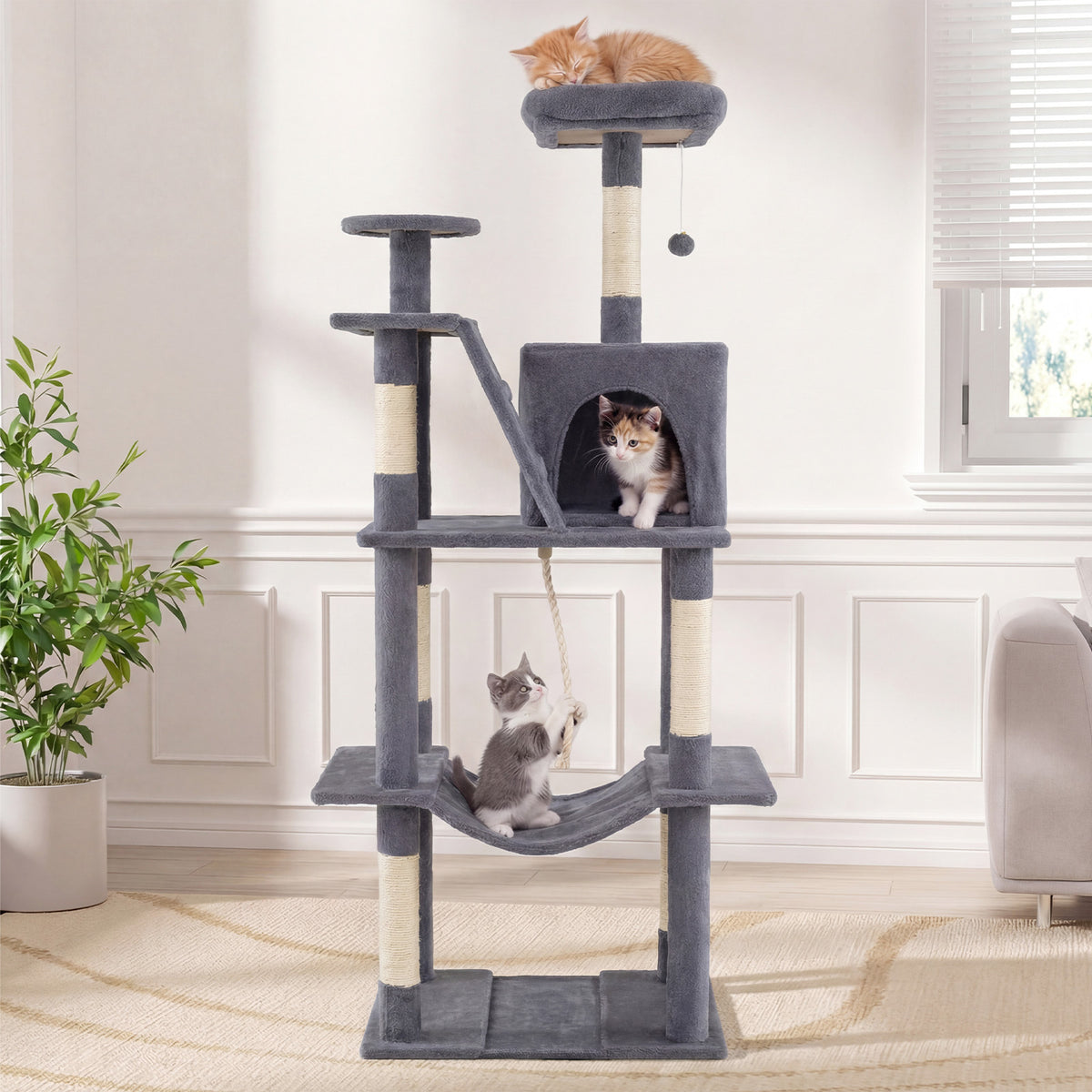 The tall cat tree tower with scratching posts and perches in a bright room