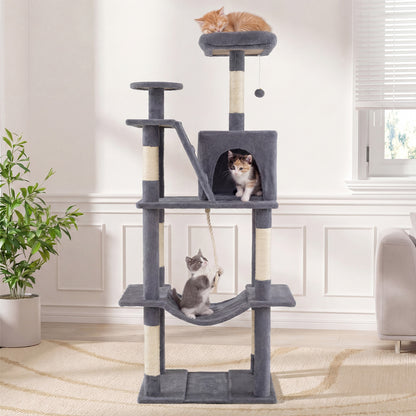 The tall cat tree tower with scratching posts and perches in a bright room