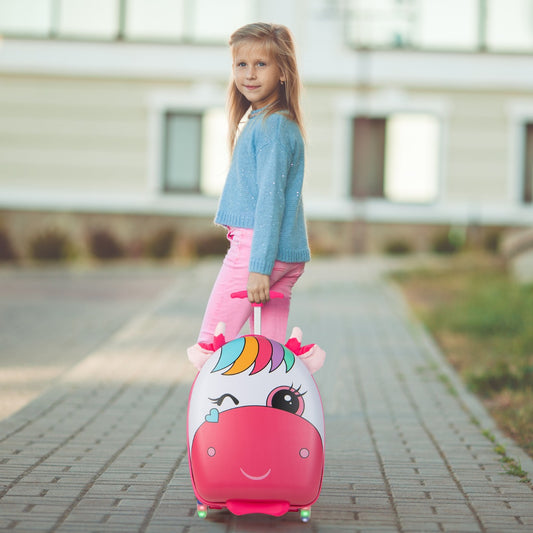 Girl pulling the pink horse kids luggage with light-up wheels on a pavement