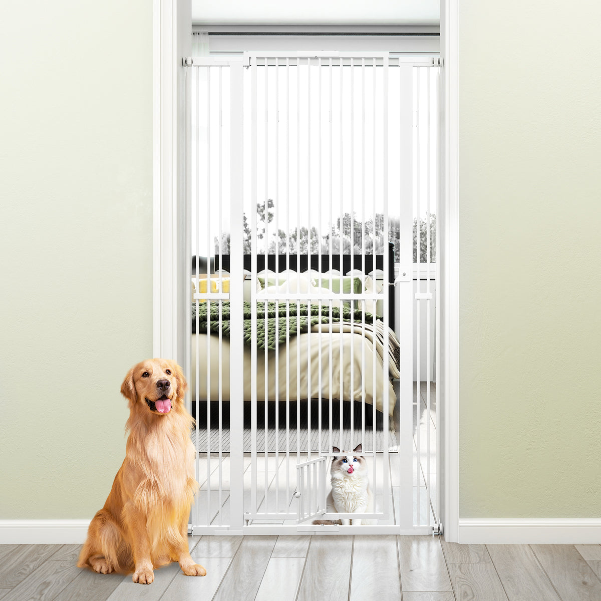 The tall white metal pet gate is installed in a doorway with a golden retriever and a cat sitting in front of it