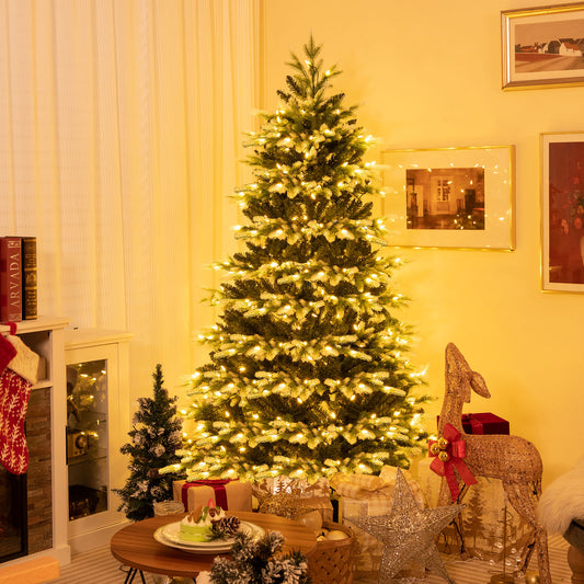 the Christmas tree decorated with lights and set up in a cosy room with presents underneath