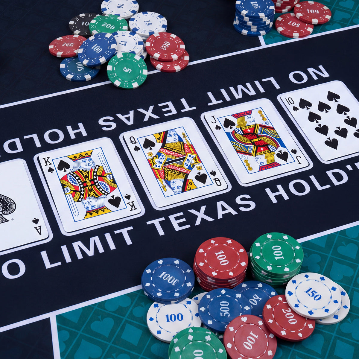 The game mat surface with playing cards and stacks of colourful plastic chips