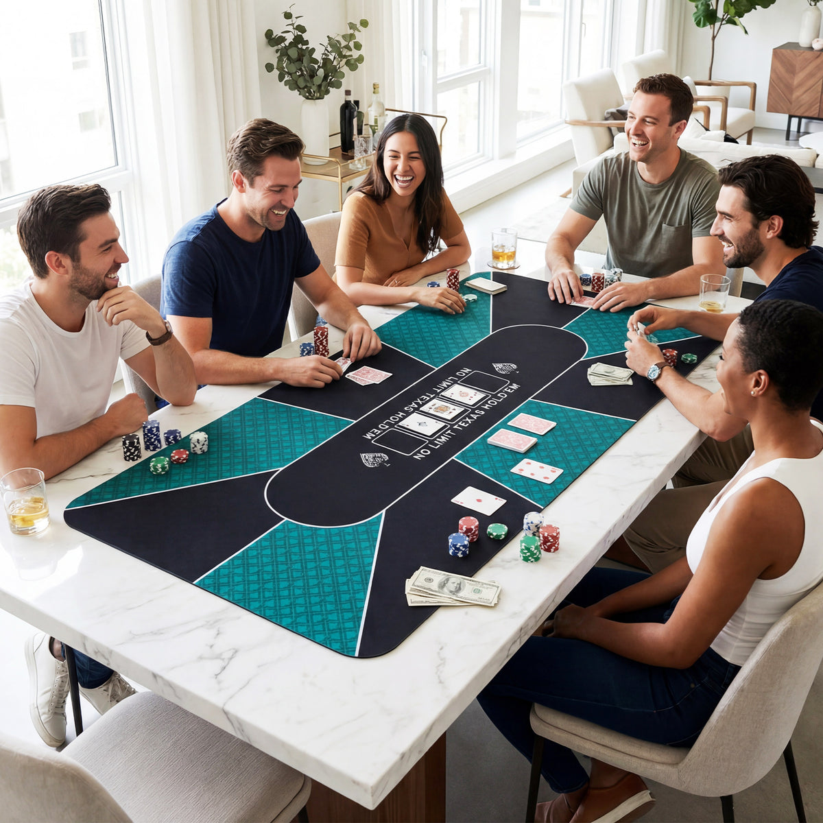 The game mat placed on a white marble dining table with friends playing a card game