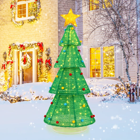 the lighted collapsible Christmas tree set up outside a house at night