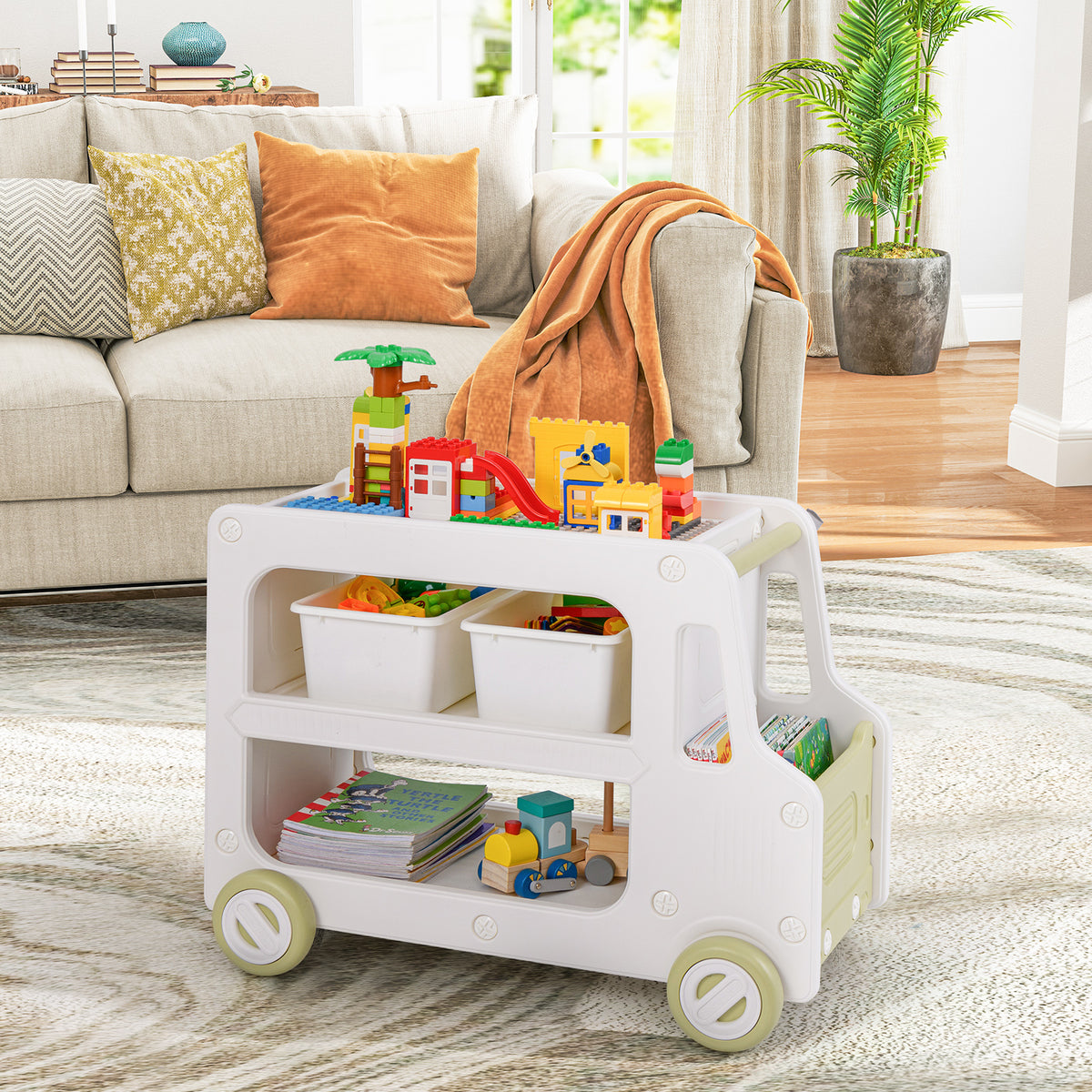 The kids storage cabinet filled with toys and books in a living room setting