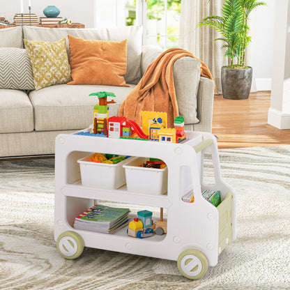 The kids storage cabinet filled with toys and books in a living room setting