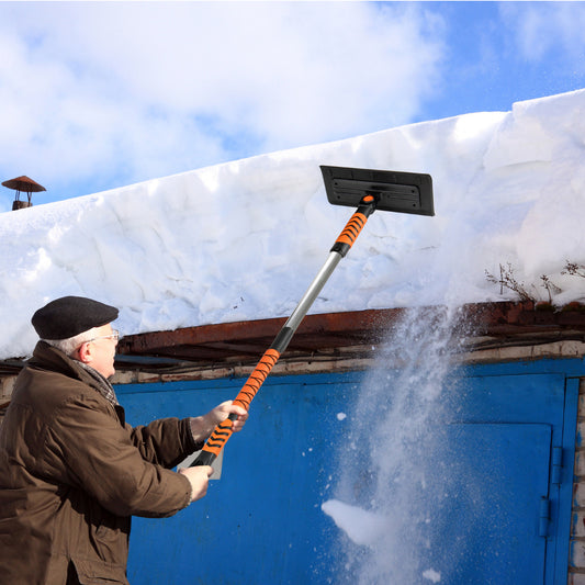 The garden tool being used by a person to clear heavy snow from a garage roof