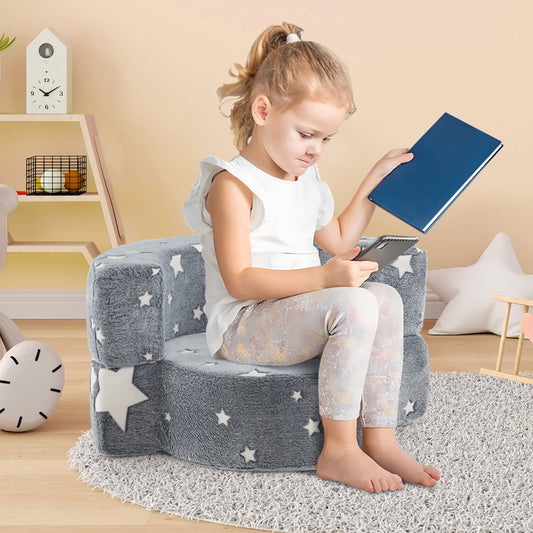 2 in 1 Glow in the Dark Sofa, the kids chair with a young girl sitting on it reading a book in a bright nursery room