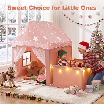 A mother and child playing with the pink play tent and playpen at Christmas
