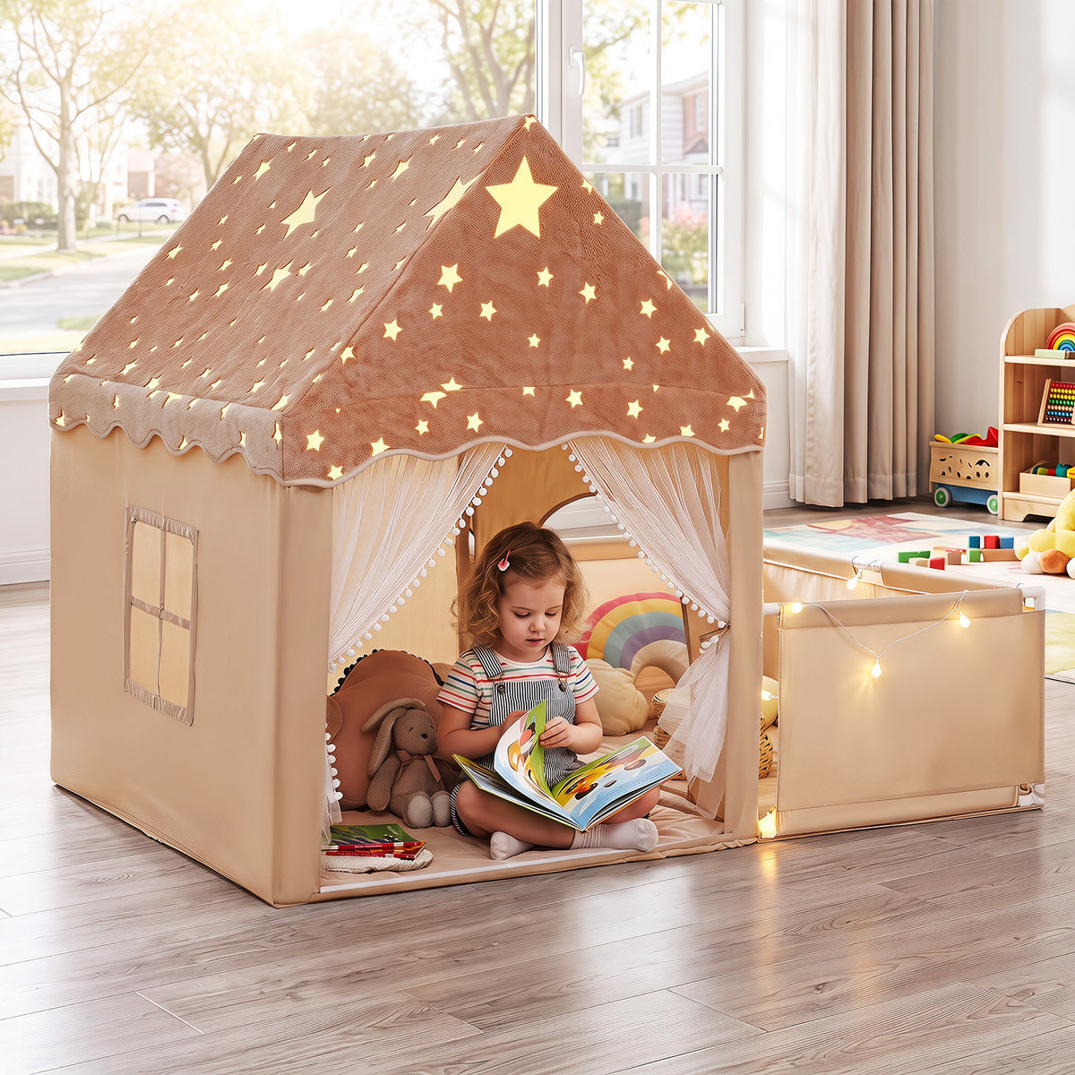 the beige play tent with star roof and sheer curtains set up on a wooden floor