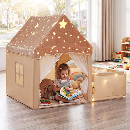the beige play tent with star roof and sheer curtains set up on a wooden floor