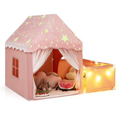 Close up of the pink play tent interior with soft toys and fairy lights
