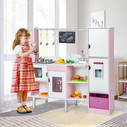 A young girl playing with the pink play kitchen and market set, holding a toy bottle near the sink area