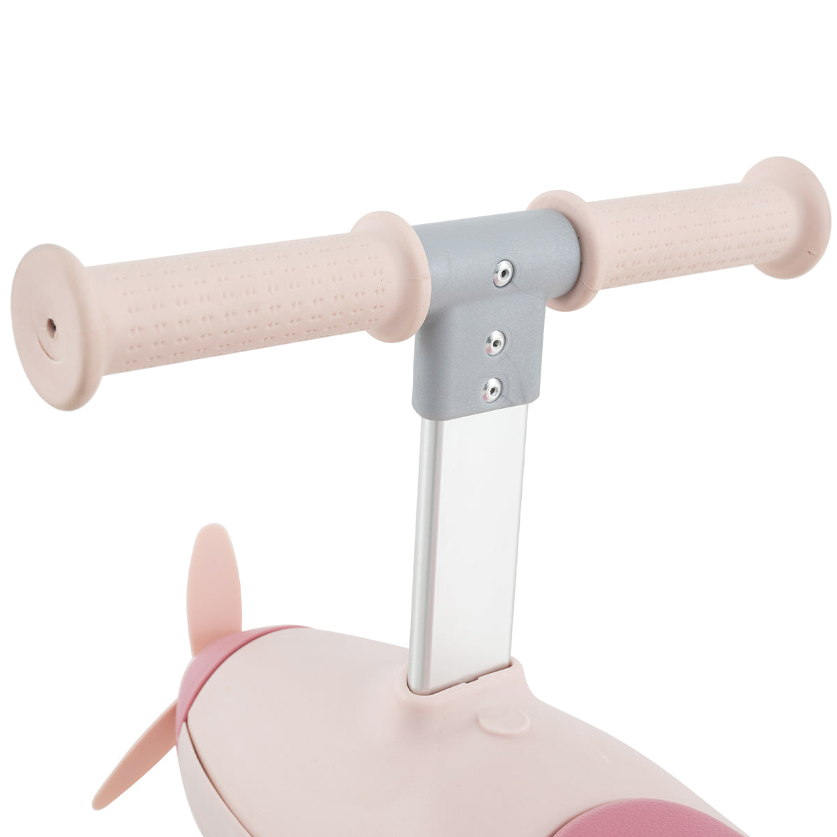 A close up of the handlebars and the front propeller detail on the pink ride on toy