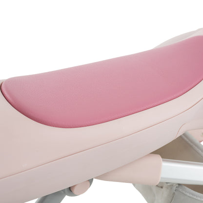 A close up of the padded pink seat on the ride on toy with a storage bag underneath