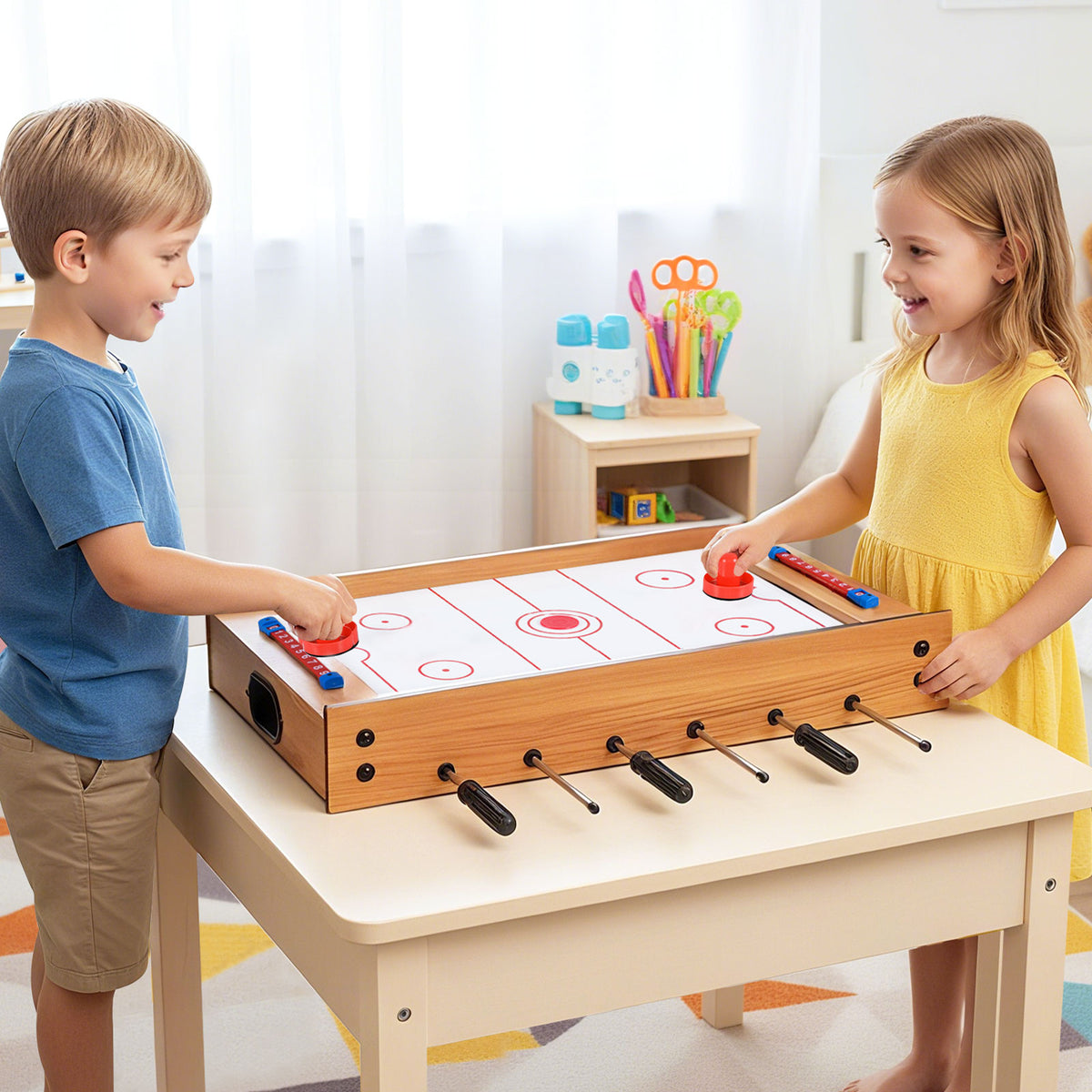 Two children playing a game of tabletop hockey on the wooden game board placed on a table