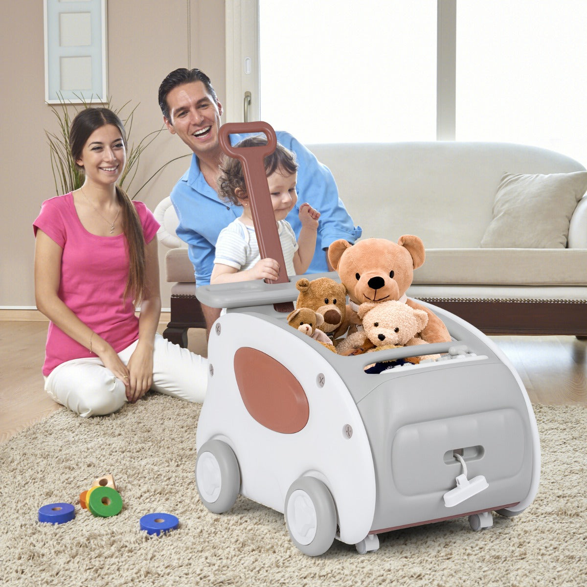 A family sits on the floor with the grey baby walker