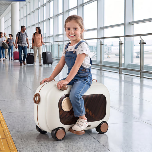 A young girl sitting on the ride-on kids luggage in an airport terminal