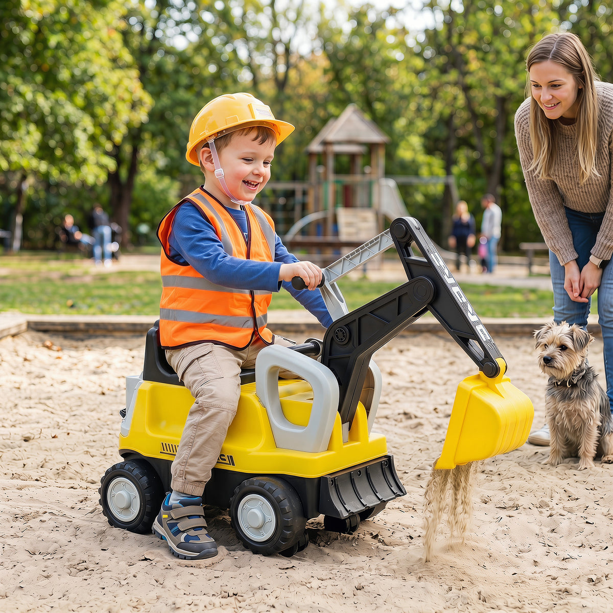 The push car in a sandpit with a child operating the yellow digging arm