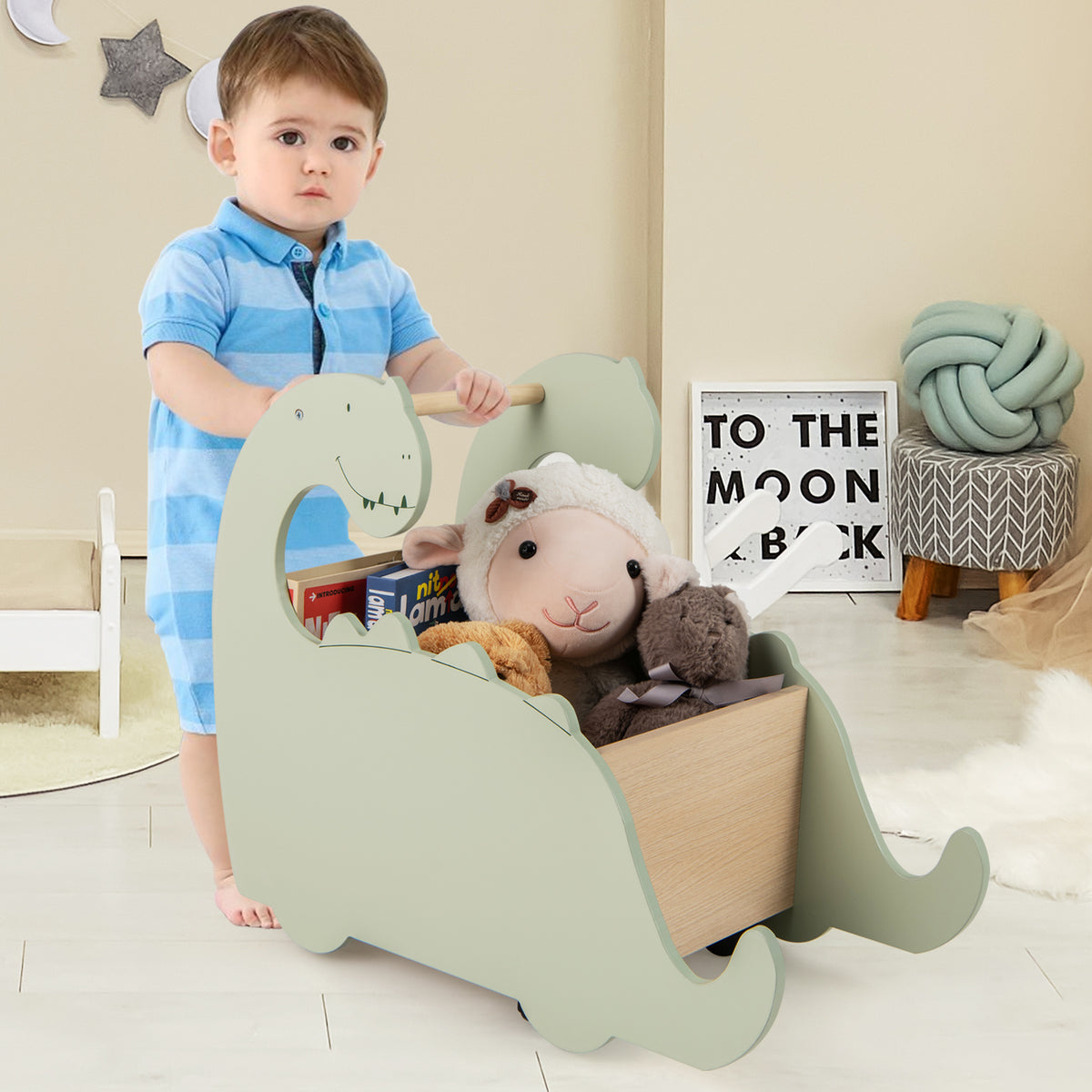 The baby walker being pushed by a toddler in a bright playroom setting