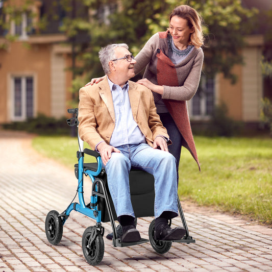 Elderly man sitting on the navy blue rollator walker with seat, being pushed by a woman outdoors