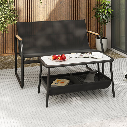 Black patio furniture set with a loveseat and coffee table with storage on a patio