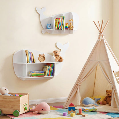 The two white whale shaped wall shelves mounted in a playroom near a teepee and toy box