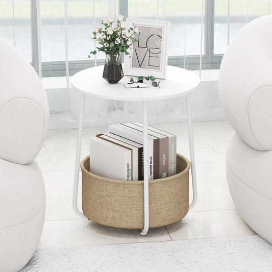 White round end table with a fabric basket holding books, in a bright room
