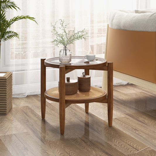 The round side end table in a bedroom setting next to a bed