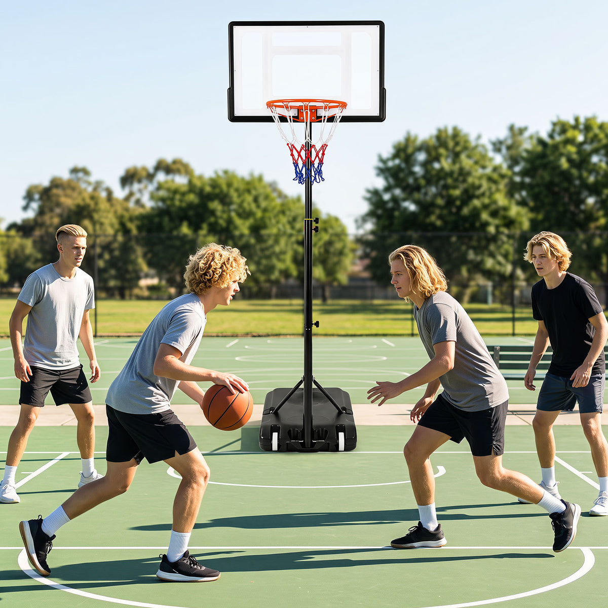 Teens playing basketball with the adjustable hoop on an outdoor court