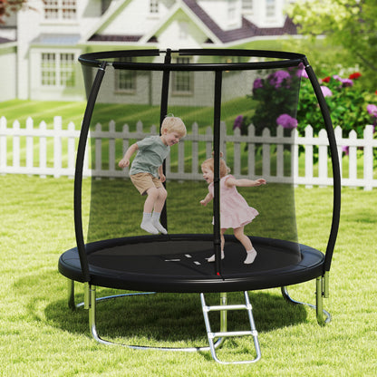 Children jumping on the round trampoline in a garden setting