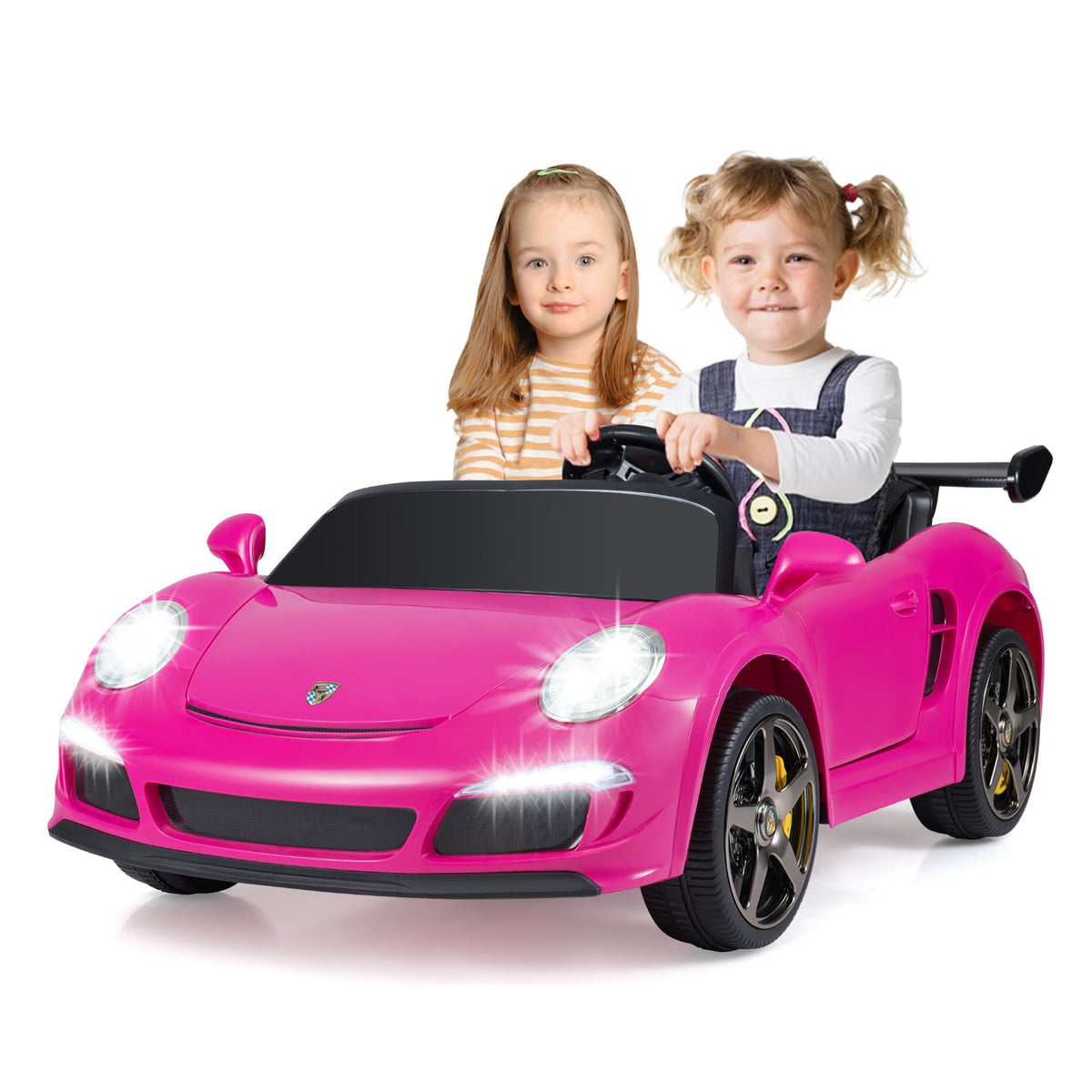 Two young children sit in the pink kids electric car
