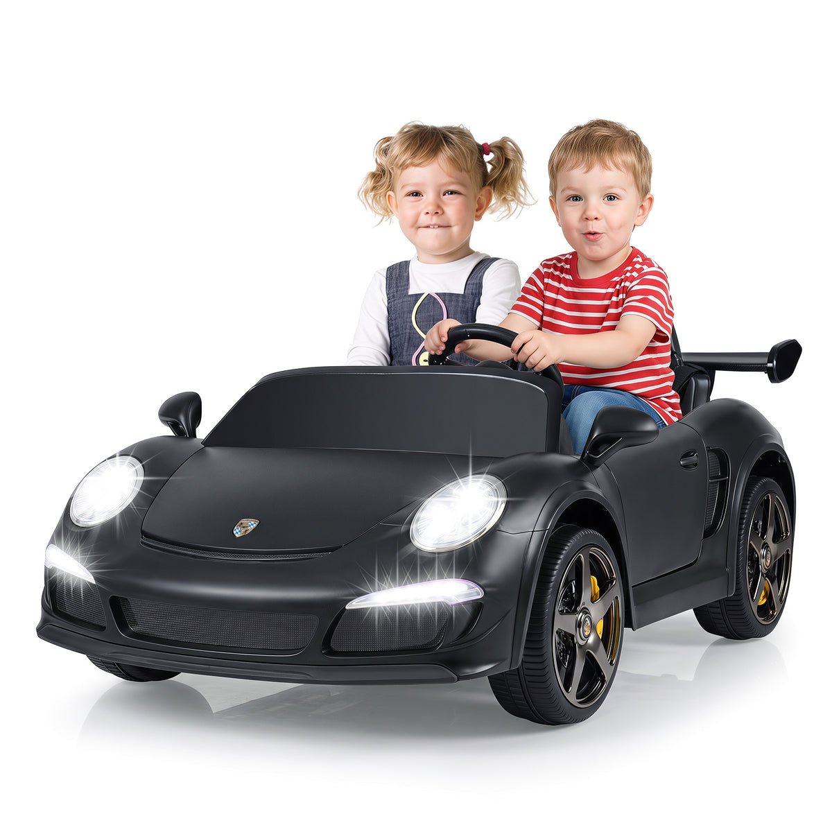 The kids electric car with a young boy and girl sitting inside on a white background