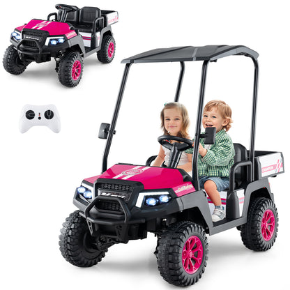 The pink kids golf cart with two children sitting inside and a remote control nearby