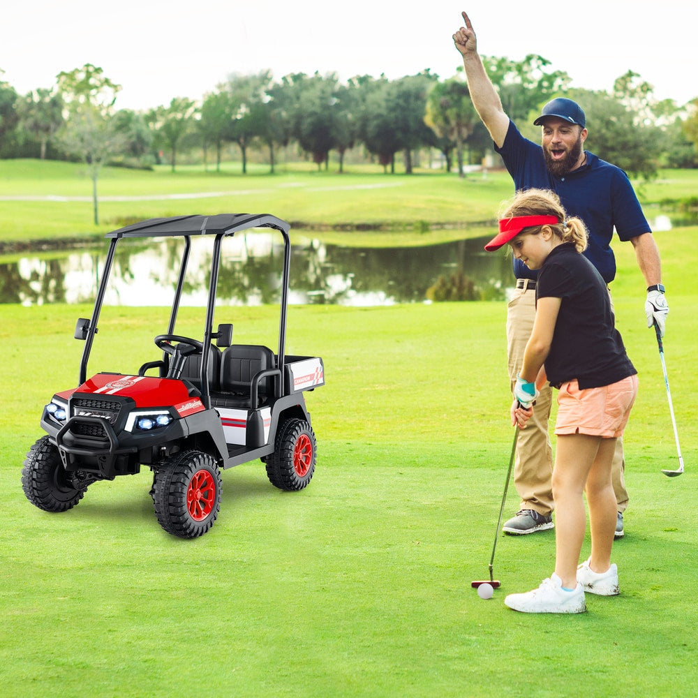 A father and daughter playing golf with the kids electric car nearby