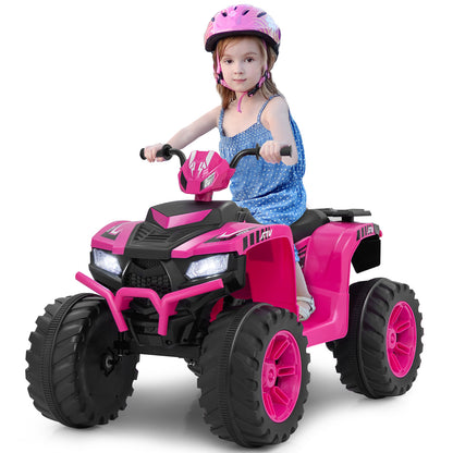 Young girl wearing a helmet rides the pink kids electric quad bike