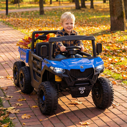 The blue kids electric car with a child driving and autumn leaves in the back