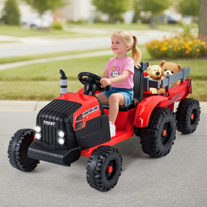 A young girl enjoys riding the red electric tractor with a trailer in a suburban setting