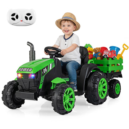 A young boy in a straw hat driving the electric tractor with a remote control shown above