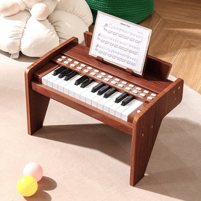 The wooden piano keyboard with a sheet music book placed on the stand in a bright playroom