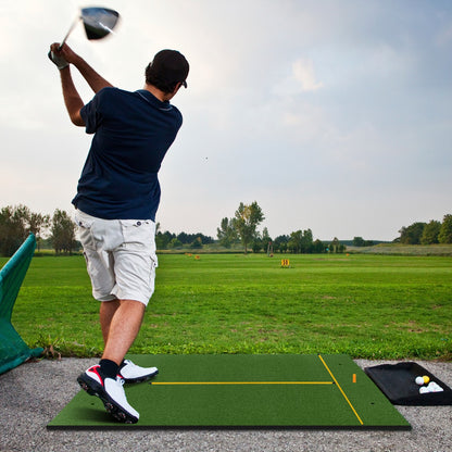 The golf hitting mat being used by a man for a driver swing at a driving range