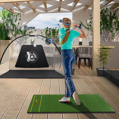 Woman using the golf hitting mat for a swing on a wooden deck with a golf net
