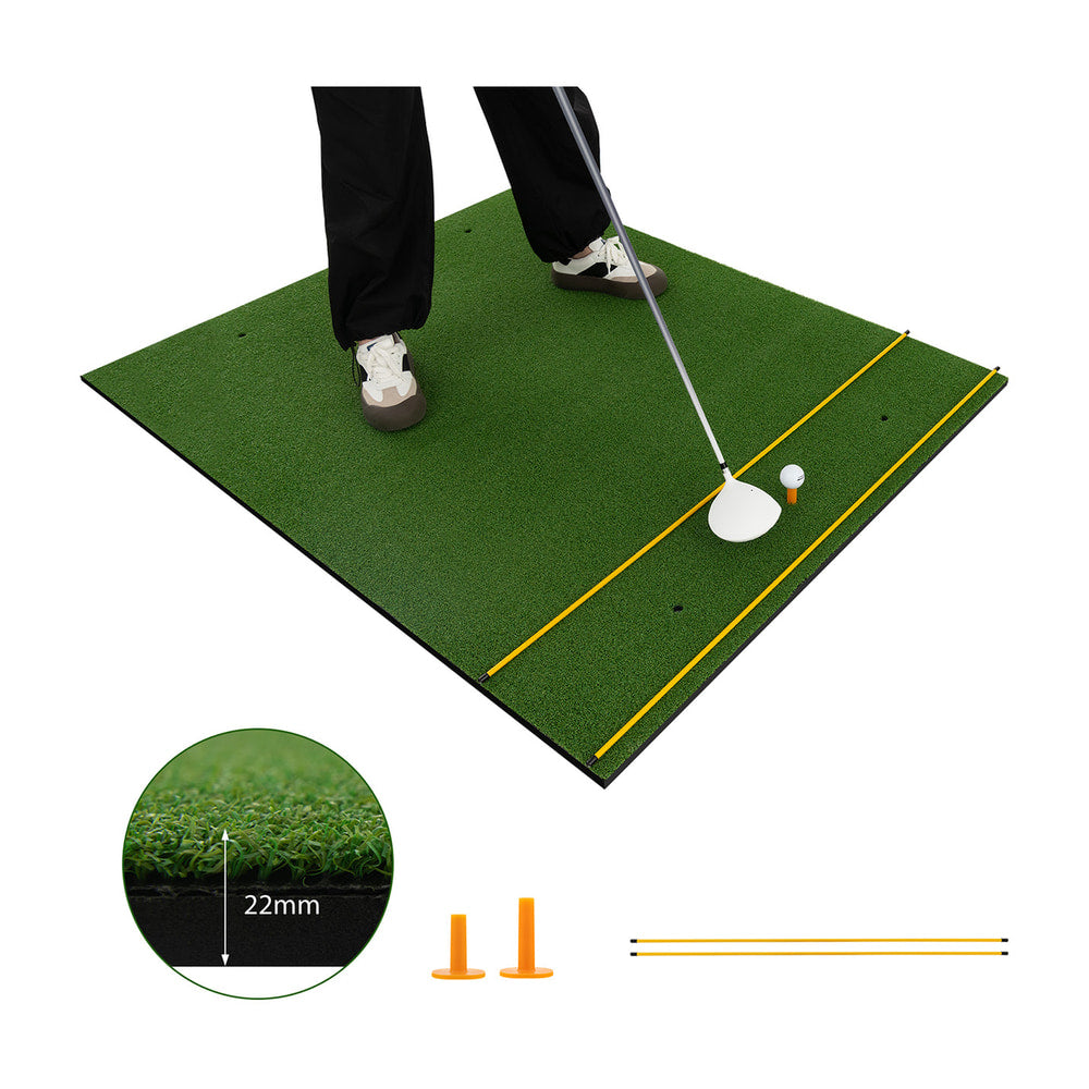 25 mm Golf Hitting Mat with two rubber tees and two alignment sticks, shown with feet on the mat