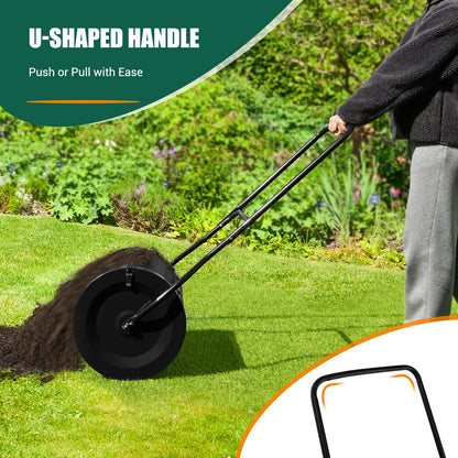 Close-up of the U-shaped handle on the lawn care tool being used to spread soil on grass