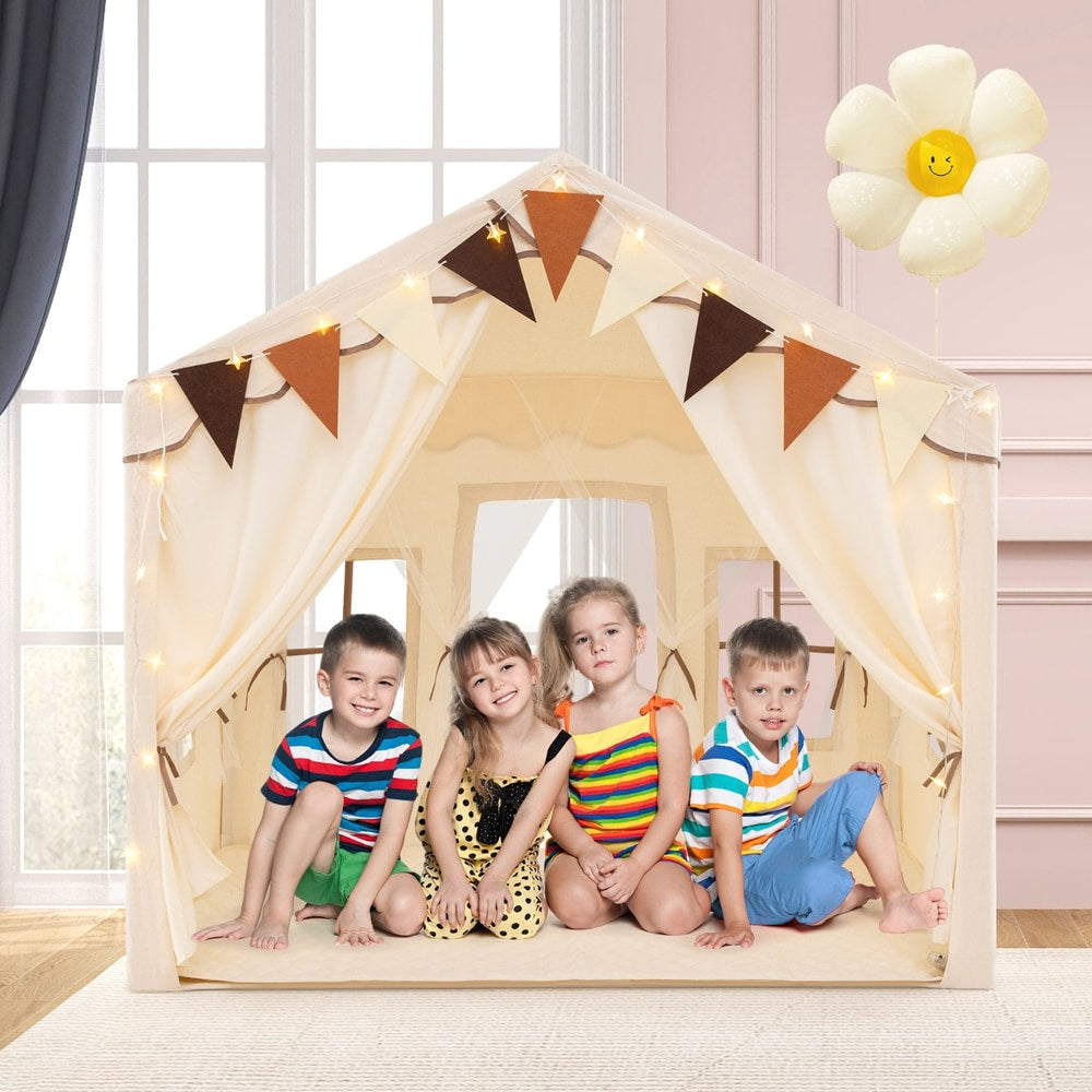 Four children sitting inside the beige play tent house
