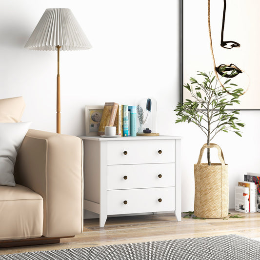 White three-drawer wooden dresser chest of drawers in a living room setting next to a sofa