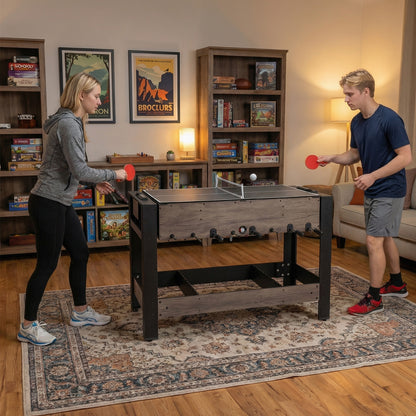 The game room table set up for table tennis with two people playing in a lounge