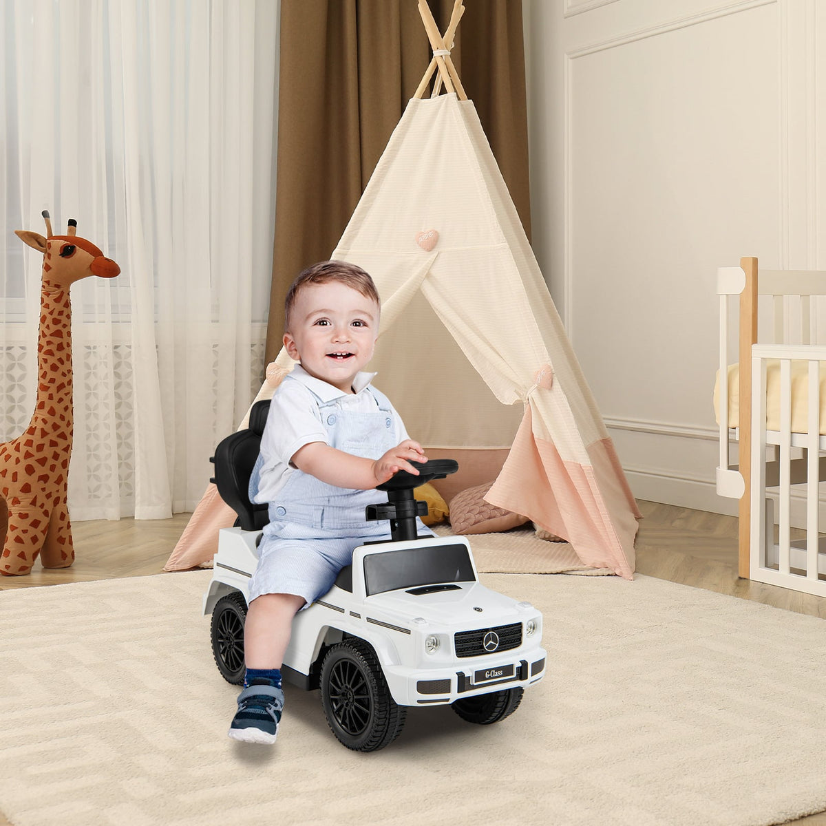Smiling baby sitting in the white baby walker car in a nursery room