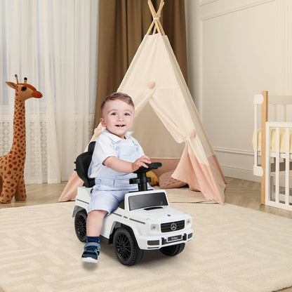 Smiling baby sitting in the white baby walker car in a nursery room